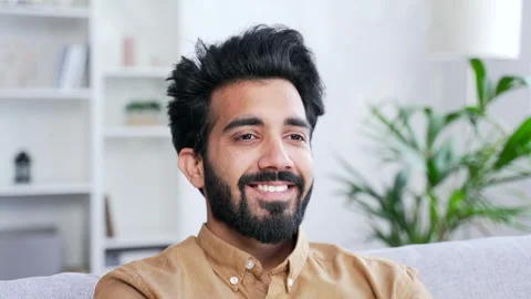 Close up of a young handsome man relaxing with his eyes closed while sitting on  Stock Footage 252215564