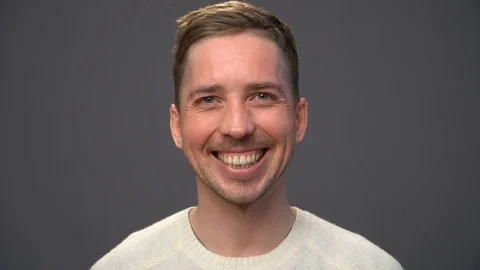 Close up young handsome man smiling Stock Footage 70486320