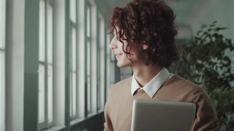 Close Up Of Young Handsome Man Student Using Laptop In University Stock Footage 67108674