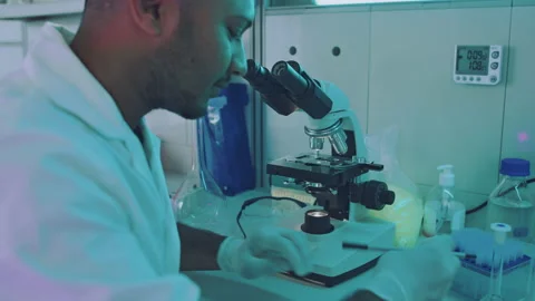 Close Up of a Young Hardworking Ethnic Lab Scientist Stock Footage 164992805
