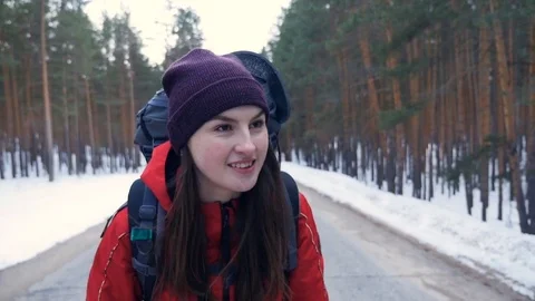 Close-up. Young Hiker female Backpack Walking on a empty road. Slow motion Stock Footage