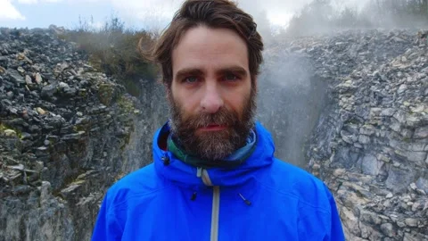 Close-up young hiker man with beard tourist explorer hiking trekking smiling ste Stock Footage 164045908