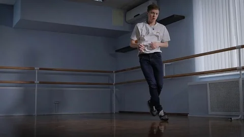 Close up of young hip-hop dancer dressed in black trousers and white shirt Stock Footage 70367715