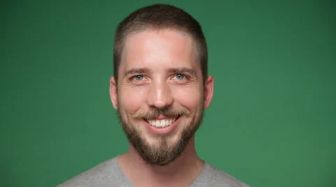 Close-up of a young hipster man with beard smiling, chroma key green screen Stock Footage 68811593