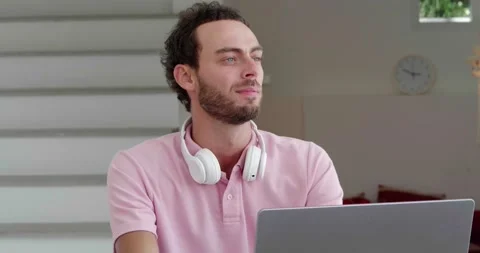 Close-up of young inspired journalist, thoughtfully looking aside while writing Stock Footage 219951327