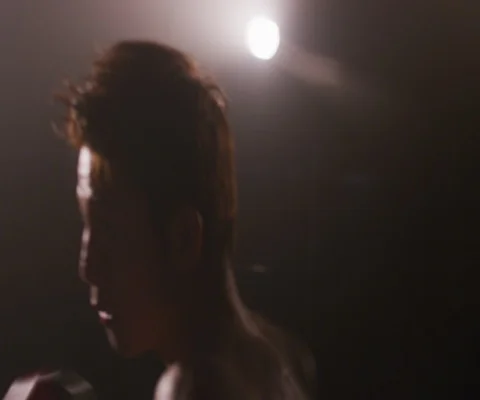 Close up of young Japanese man practising hitting and punching with red gloves Video stock 147050247