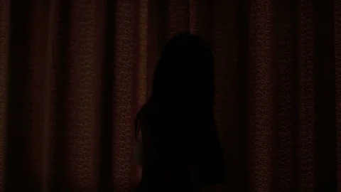 Close up of young lady drawing the curtain in the bedroom in the morning time Stock Footage 73815060
