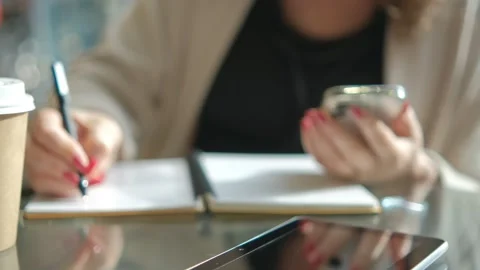 Close-up young lady freelance focus mobile phone chat with colleagues work Stock Footage 258650983