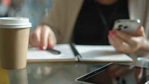 Close-up young lady freelance focus mobile phone chat with colleagues work Stock Footage 258651126