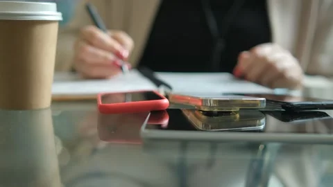 Close-up young lady freelance focus mobile phone chat with colleagues work Stock Footage 263898392