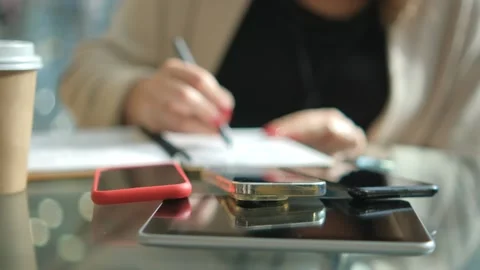 Close-up young lady freelance focus mobile phone chat with colleagues work Video stock 264879304