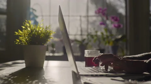 Close up of a young lady typing in slow motion 動画素材 151617209
