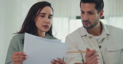 Close up young Latin couple check document paper pay bills online plan budget. Video stock 337040570