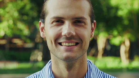 Close Up of Young Lawyer Smiling at the Camera, Well-Dressed on a Background of Video stock 312730933