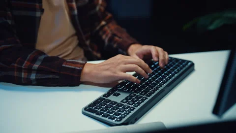 Close up young Male programmer hands typing on keyboard in office at night. Video stock 344047674