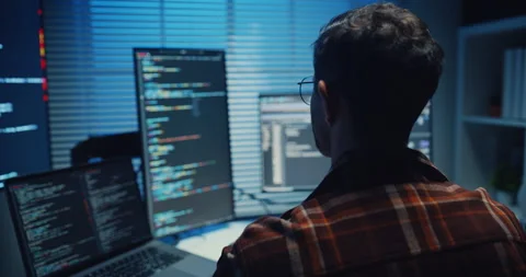 Close up young Male programmer hands typing on keyboard in office at night. Video stock 344047948