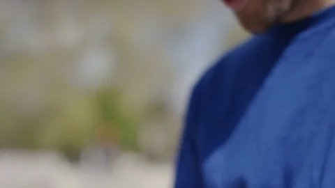 Close up of young male using his phone, in slow motion Stock Footage 74893736