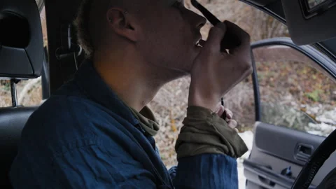 Close-Up of Young Man Applying Eye Makeup in Car 스톡 동영상 302211476