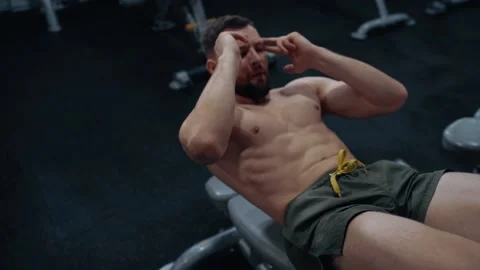 Close-up of the young man with the bare chest performing the lifting of the Stock Footage 156868922