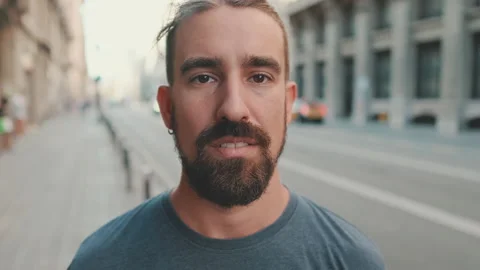 Close-up of young man with beard looking at the camera Video stock 226903243
