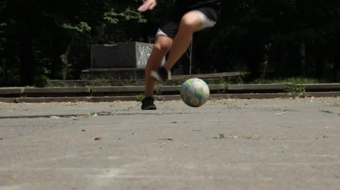 Close up of Young Man Demonstrating Footwork by Dribbling Soccer Ball Stock Footage 51344032