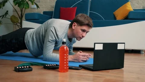 Close up of an young man doing plank exercise at home. Stock Footage 144615639