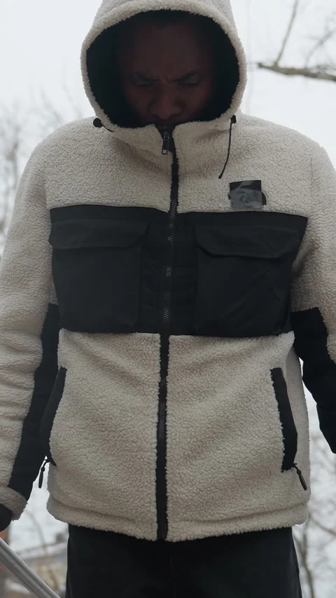 Close-Up of Young Man Doing Push-Ups on Outdoor Parallel Bars in Snowy Weather Stock-Footage 318584240