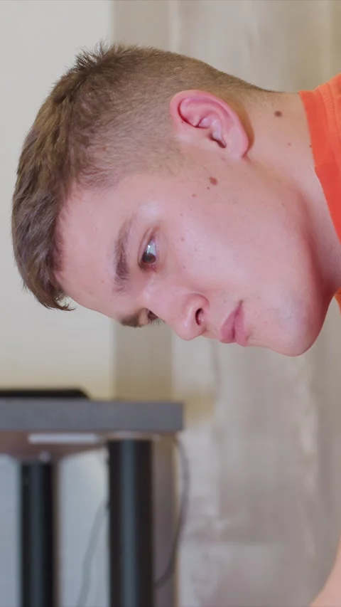 Close up of young man ear and side profile with soft indoor lighting showing Stock Footage 346787935
