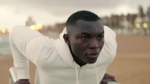 Close-up of young man exercising on parallel bars outdoors Stock-Footage 294080701
