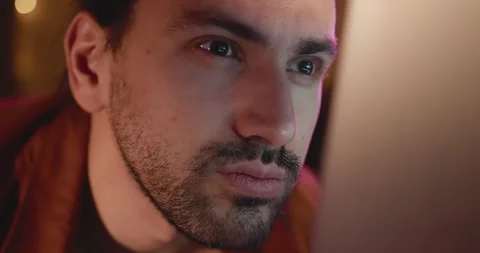 Close-up of a young man, eyes look at the monitor, work with a computer, laptop Stock Footage 171365558