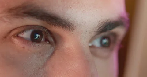 Close-up of a young man, eyes look at the monitor, work with a computer, laptop Stock Footage 186600899