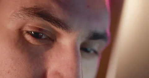 Close-up of a young man, eyes look at the monitor, work with a computer, laptop Stock Footage 218590280