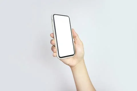 Close up of young man hand holding modern smart phone mockup. New modern bl.. Stock Photos