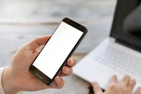 Close up of young man hand using mobile smartphone with blurred background Stockfoto's