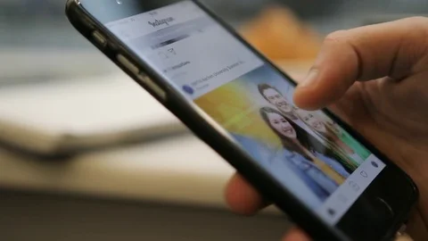 Close up of young man hands scrolling pictures, social network, app on Stock Footage 72361769