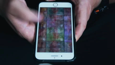 Close-up Of Young Man Hands Typing Sms Scrolling Pictures Phone Video stock 240753385