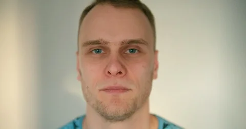 Close up of young man hitting himself with his hand hard so his head is Stock Footage 121691923