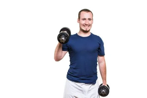 Close up of young man lifting weights over white background Stock Photos