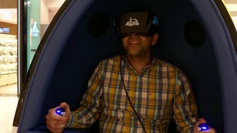 Close up Young man looking around trying virtual reality simulator experience 9D Stock Footage 75043866