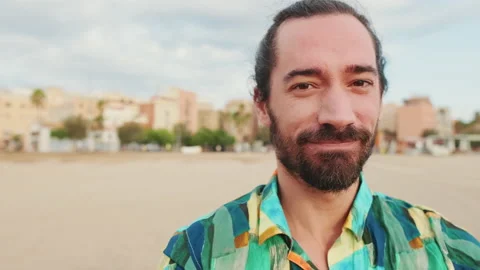 Close-up of young man looking at the camera and smiling Video stock 227156251
