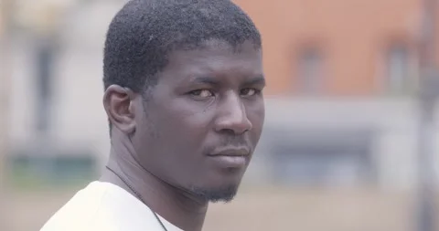 Close up young man looking serious and proud into camera 库存影片 333197630