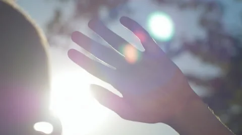 Close-up of young man looking at the sun in nature 스톡 동영상 67040012