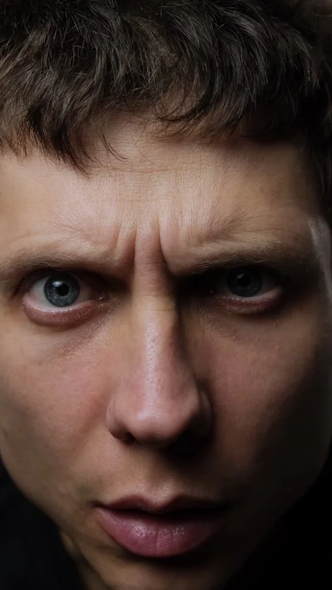 Close-up of young man looking surprised at camera, concept of shock Vídeo Stock 318066825