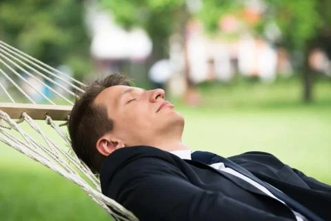 Close-up Of Young Man Lying In Hammock Stock Photos