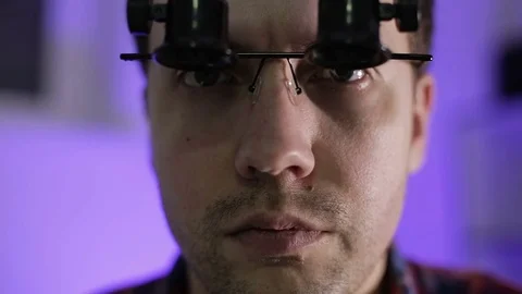 Close up. The young man in the magnifying glasses. Stock Footage 70902460