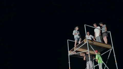 Close-Up of a Young Man Makes Extreme Jump From a Tower on an Air Cushion at Stock Footage 60681444