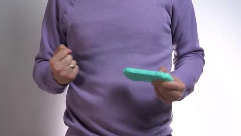 Close-up of young man playing game on game console Stock Footage 311475627