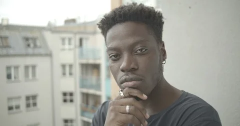 Close-up of young man posing against the building Stock Footage 120424133