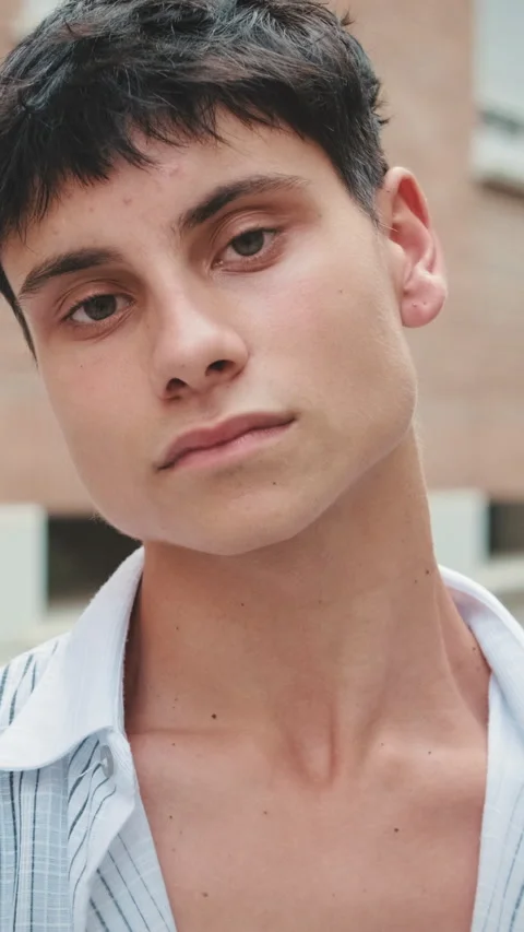 Close up, young man posing looking at camera on the street Stock Footage 252208014