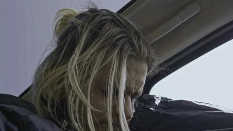Close-up of young man sitting nervously in car. Stock. Man with panic attack is Stock Photos